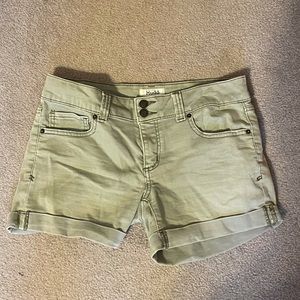 olive green denim shorts with rolled legs